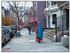 woman carrying cello down West Side Manhattan street